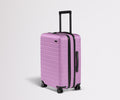 Away The Bigger Carry-On Flex Suitcase - Taffy Purple