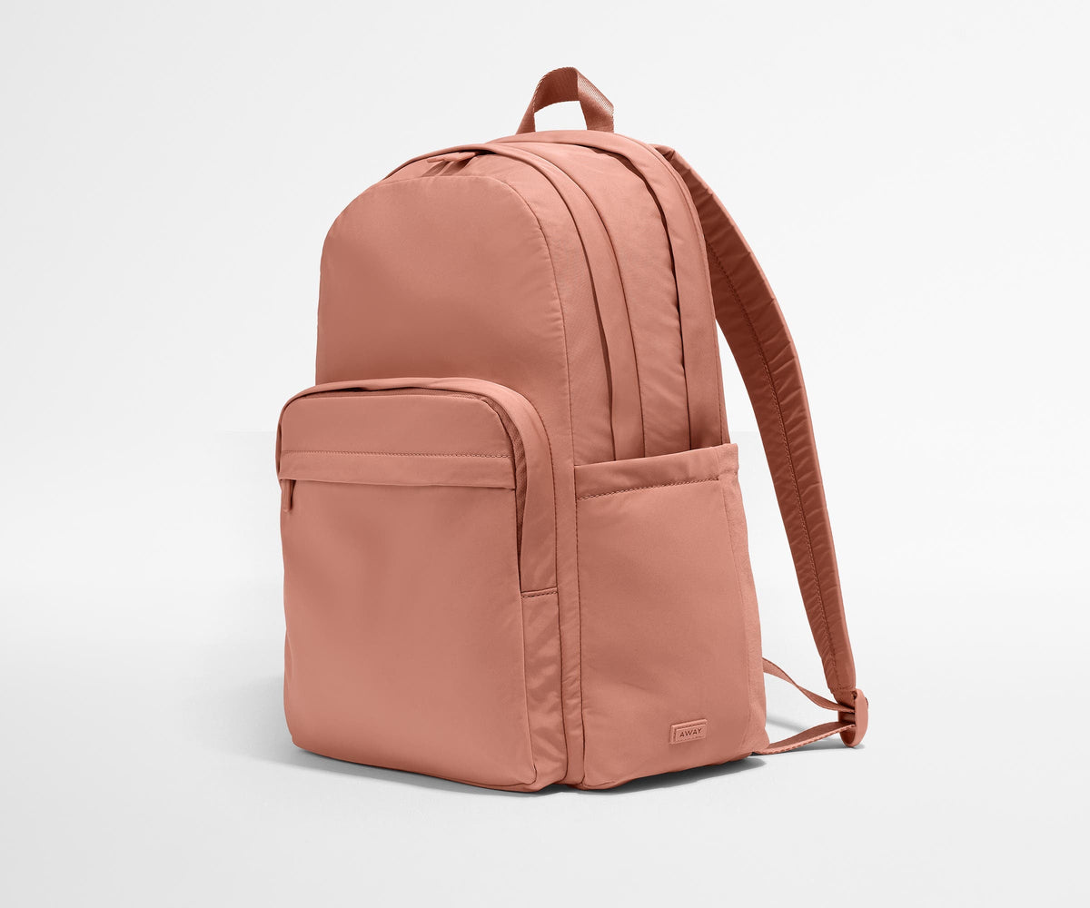 Away Large Featherlight Backpack in Clay Pink