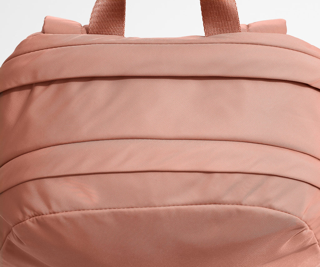 Away Large Featherlight Backpack in Clay Pink
