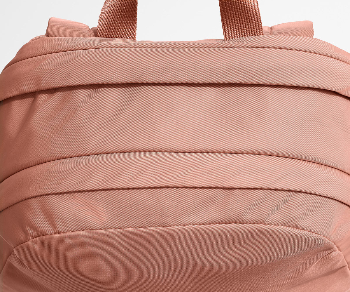 Away Large Featherlight Backpack in Clay Pink