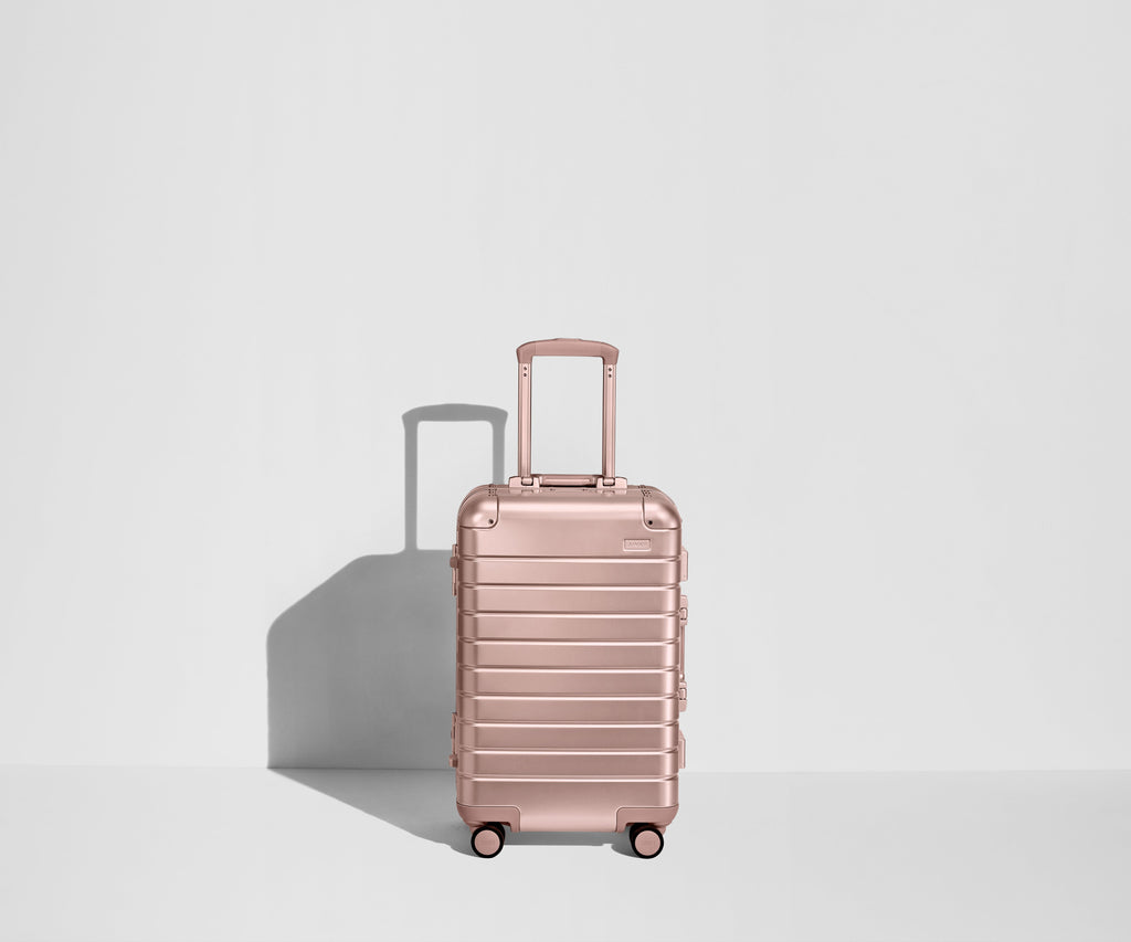 Away The Bigger Carry-On: Aluminum Edition Suitcase - Rose Gold (with USB charger)