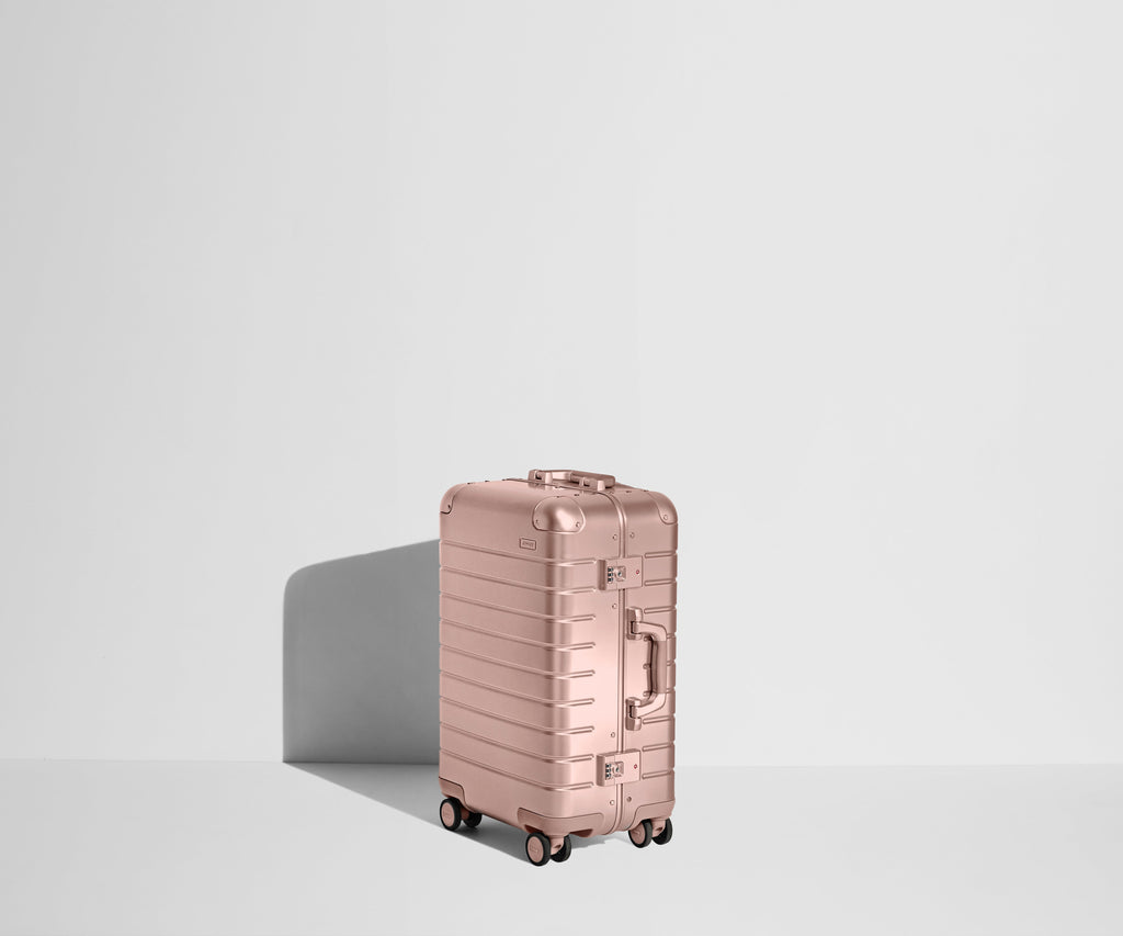 Away The Bigger Carry-On: Aluminum Edition Suitcase - Rose Gold (with USB charger)