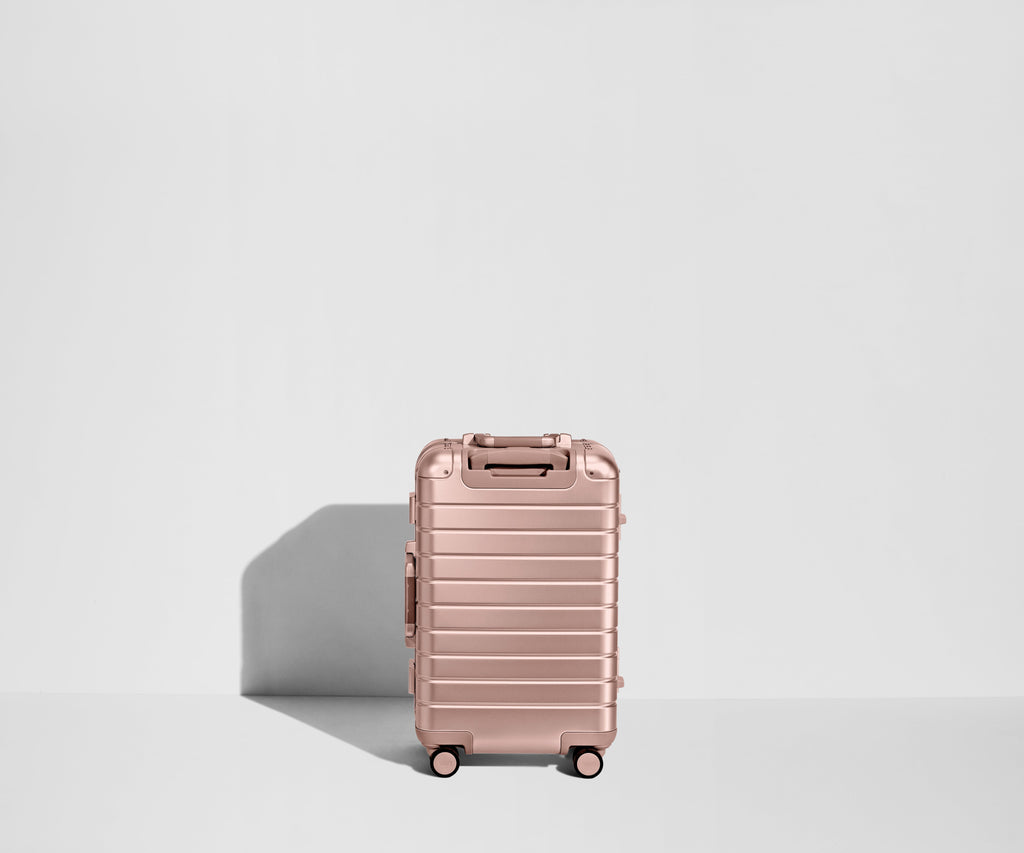 Away The Bigger Carry-On: Aluminum Edition Suitcase - Rose Gold (with USB charger)