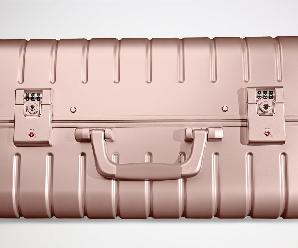 Away The Bigger Carry-On: Aluminum Edition Suitcase - Rose Gold (with USB charger)