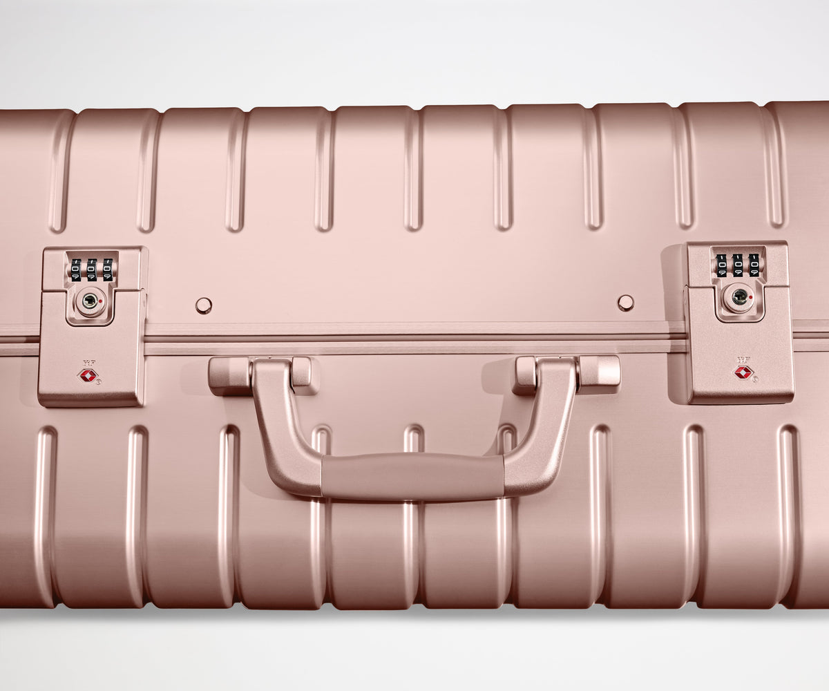 Away The Bigger Carry-On: Aluminum Edition Suitcase - Rose Gold (with USB charger)