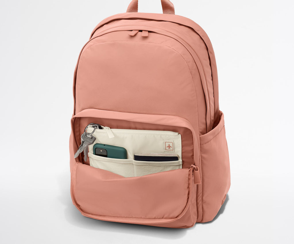 Away Large Featherlight Backpack in Clay Pink
