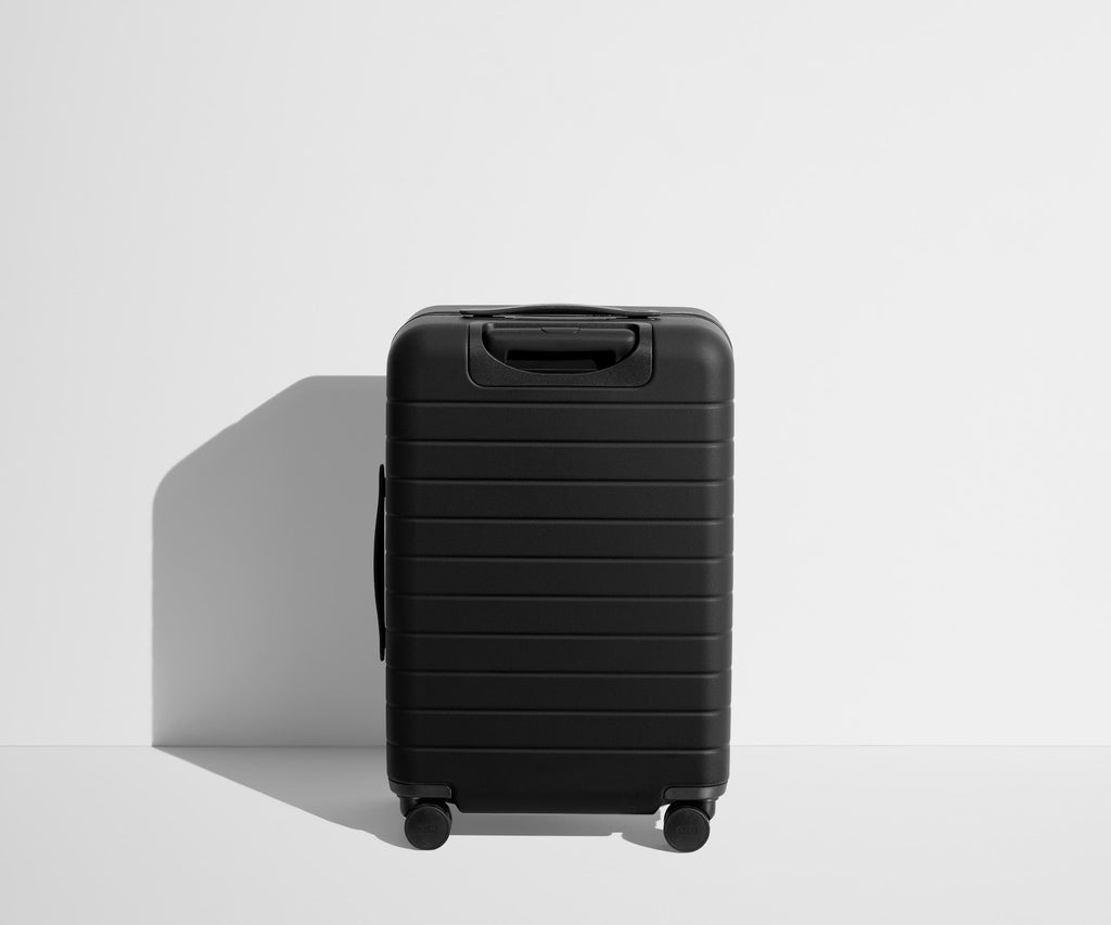 Away The Collegiate Bigger Carry-On Suitcase - The University of Texas